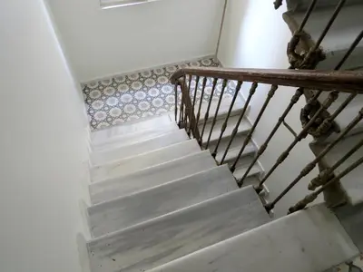 a stairway with a wooden railing and a stair case at Istanberry - Berry Life Apartments in Istanbul