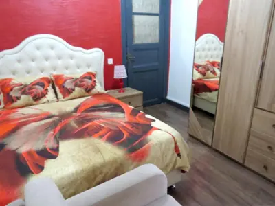 a bedroom with a white bed and a mirror at Istanberry - Berry Life Apartments in Istanbul