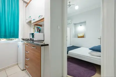 a small room with a bed and a kitchen at Istanbul House in Istanbul