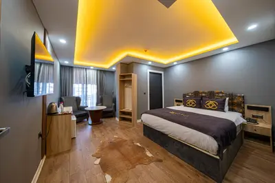 a bedroom with a bed and a yellow ceiling at Viv City Hotel in Istanbul