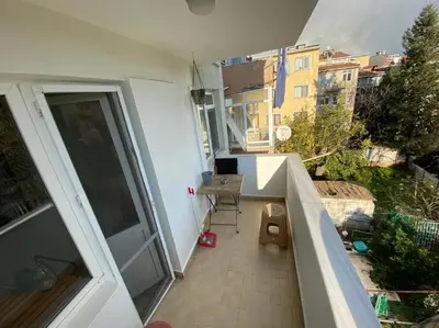 an empty balcony of a building with a sliding glass door at Large apartment with a balcony in central Kadıköy in Istanbul