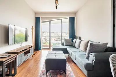 a living room with a couch and a tv at Benesta Taksim No.8 in Istanbul
