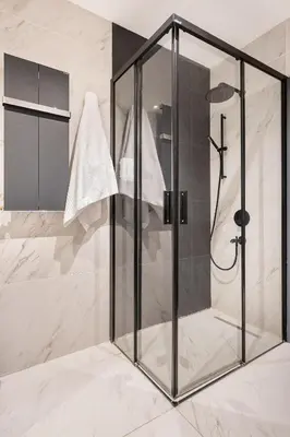 a shower with a glass enclosure in a bathroom at Benesta Taksim No.8 in Istanbul