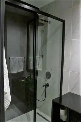 a shower with a glass door in a bathroom at Benesta Taksim No.8 in Istanbul