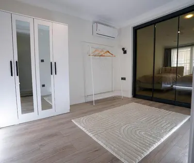 a room with a sliding glass door with a rug at Merkuri apartments in Istanbul