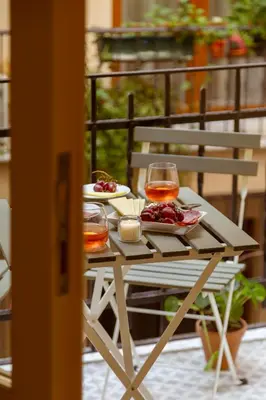 a table with two plates of food and wine glasses at Lemon Apartments in Istanbul
