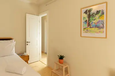 a bedroom with a bed and a picture on the wall at Lemon Apartments in Istanbul