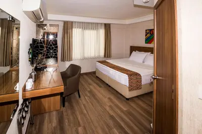 a hotel room with a bed and a desk at BGuest Hotel & Residence in Istanbul