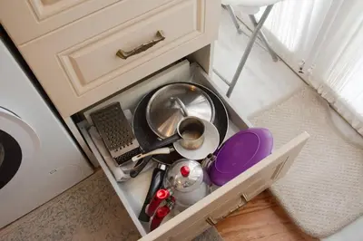 a drawer in a kitchen with some dishes in it at Stylish City Getaway-Explore the Urban Delights in Istanbul