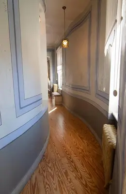 a hallway with a hard wood floor and a window at Stylish City Getaway-Explore the Urban Delights in Istanbul