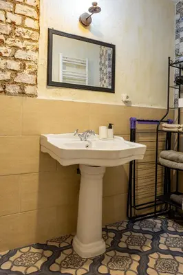 a bathroom with a sink and a mirror at Ali Pasha Apartment in Istanbul