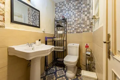 a bathroom with a sink and a toilet at Ali Pasha Apartment in Istanbul