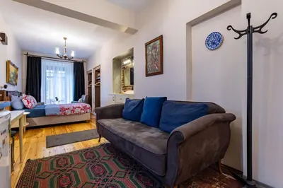 a living room with a couch and a bed at Ali Pasha Apartment in Istanbul