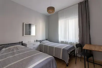 a bedroom with two beds and a window at Bright 3BR Apartment Near Kadıköy Seaside in Istanbul