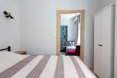 a bedroom with a bed and a living room at Bright 3BR Apartment Near Kadıköy Seaside in Istanbul