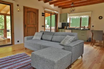 a living room with a couch and a kitchen at Lal Hayal Konakları in Sakarya