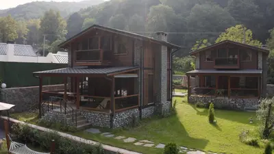 a house with a balcony and a house with a yard at Lal Hayal Konakları in Sakarya