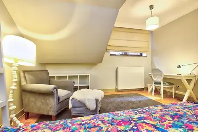 a bedroom with a bed and a chair and a desk at New Build with Modern Amenities and Balcony in Istanbul