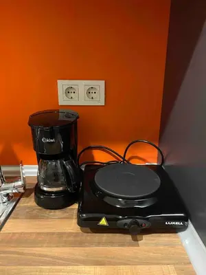 a black blender sitting on top of a counter at Cosy flat with a garden in central Kadikoy in Istanbul