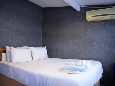 a bedroom with a bed with towels on it at Family apartment in Istanbul