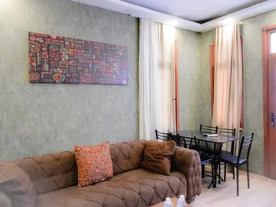 a living room with a couch and a table at Family apartment in Istanbul