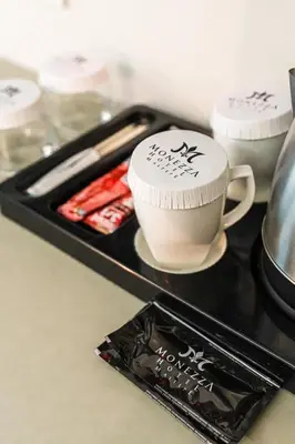a tray with a coffee mug and a cup on it at Monezza Maltepe Rezidans in Istanbul