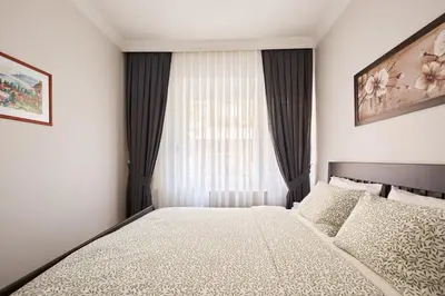 a bedroom with a bed in front of a window at Cozy Oasis in Moda Steps to Seafront in Istanbul