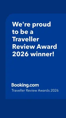 a blue sign that says were proud to be a traveller reviewagency winner at Cozy Oasis in Moda Steps to Seafront in Istanbul