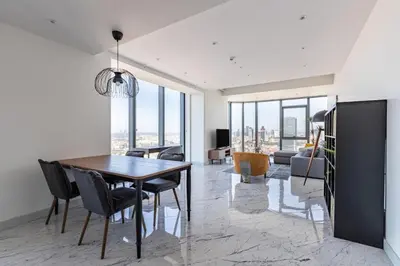 a dining room with a table and chairs at Beautiful Bright Deluxe 1BD Condo PoolViews! #311 in Istanbul