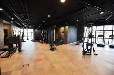 a gym with a bunch of equipment in a room at Beautiful Bright Deluxe 1BD Condo PoolViews! #311 in Istanbul
