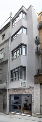 a tall building with a table in front of it at Noya Suites in Istanbul