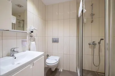 a bathroom with a shower and a toilet and a sink at The Canka Residence And Family Apartment Istanbul City Center - ŞIŞLI in Istanbul