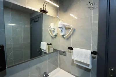 a bathroom with a sink and a mirror at Mahya Hotel in Istanbul