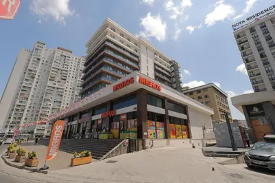 a building in the middle of a city at Cozy Homes 1 Room 1 Living room Apartment in Esenyurt