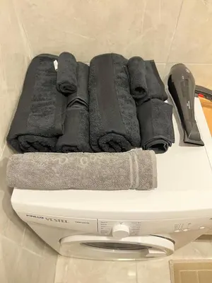 a pile of towels sitting on top of a scale at Central Location Free WIFI AC Parking Garage in Esenyurt