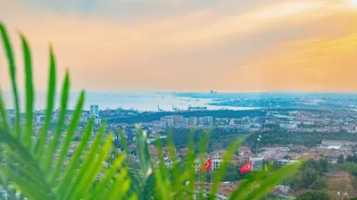 a view of a city with a rainbow in the sky at Elite Marmara Bosphorus Çamlıca in Istanbul