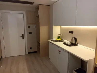 a kitchen with a sink and a counter top at Doğan Palace Hotel in Istanbul