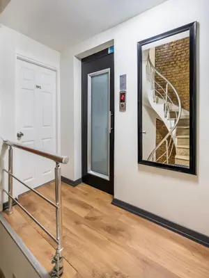 a stairwell with a door and a mirror at Taksim Trust Hotel in Istanbul