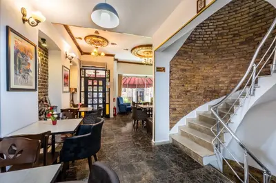 a staircase in a restaurant with a brick wall at Taksim Trust Hotel in Istanbul