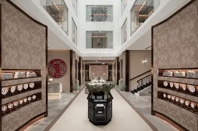 a hallway of a store with a table with flowers at Sanasaryan Han, a Luxury Collection Hotel, Istanbul in Istanbul