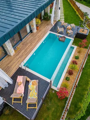 an overhead view of a swimming pool with chairs and a deck at Mjoraste Sapanca Boutique Villas in Sapanca