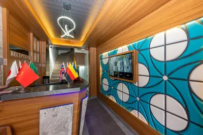 a lobby with a colorful mural on the wall at mayza otel in Istanbul