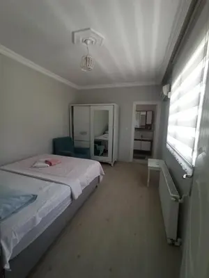 a small bedroom with a bed and a window at Grandvadi Villa kapalı ısıtmalı havuz in Sapanca