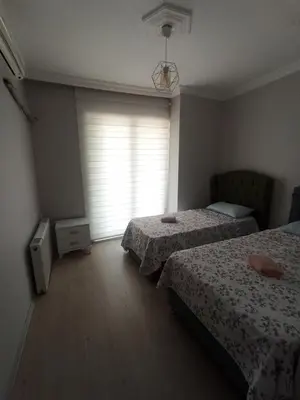 a bedroom with two beds and a window at Grandvadi Villa kapalı ısıtmalı havuz in Sapanca