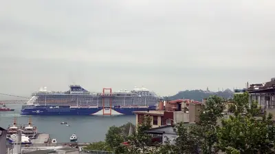 a cruise ship is docked in a harbor at Bosphorus view-Airport shutle-High Speed WIFI-Private parking in Istanbul