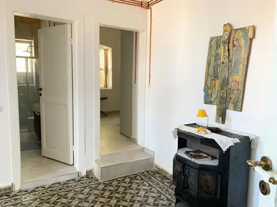 a hallway with a door leading into a room at Büyükada Al Köşk in Buyukada