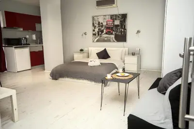 a bedroom with a bed and a table in it at Arkem Maltepe in Istanbul