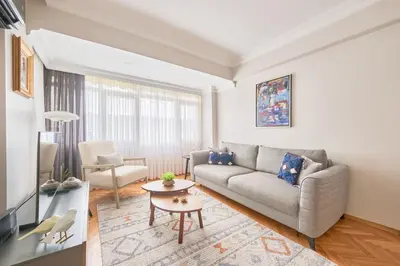 a living room with a couch and a table at Charming Bagdat Avenue Hideaway, Near Marina in Istanbul
