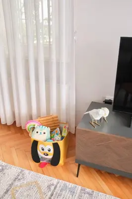 a living room with a table and a toy crib at Charming Bagdat Avenue Hideaway, Near Marina in Istanbul