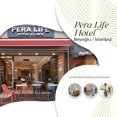 a restaurant with tables and chairs in the front of a hotel at Pera Life in Istanbul
